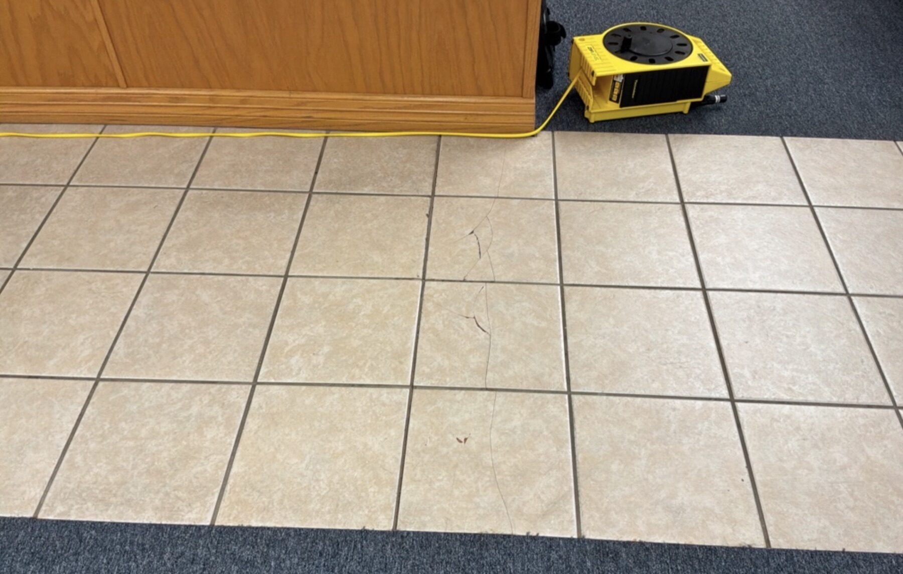 Cracked tile where the slab had settled