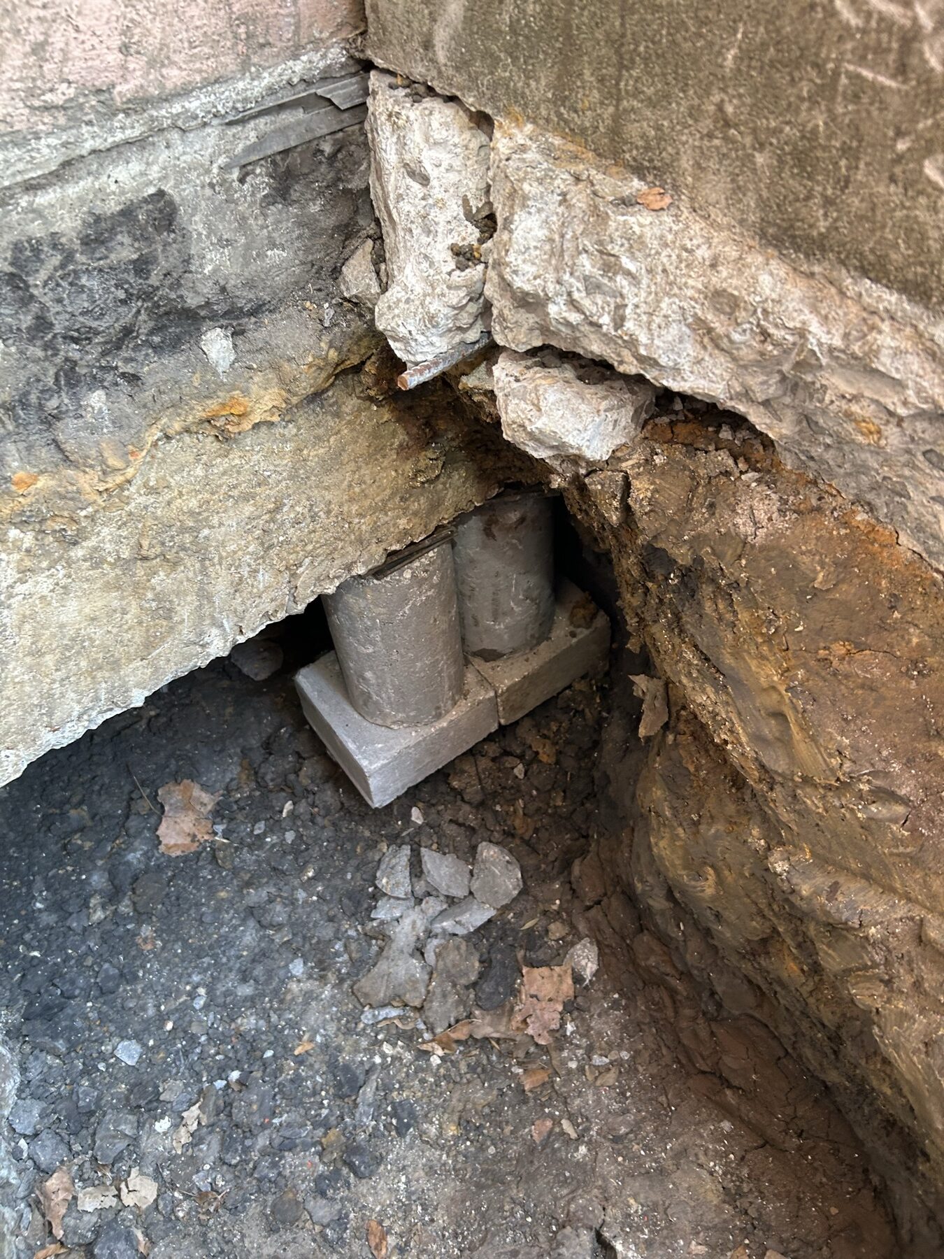 Perimeter pier installation at the exposed grade beam