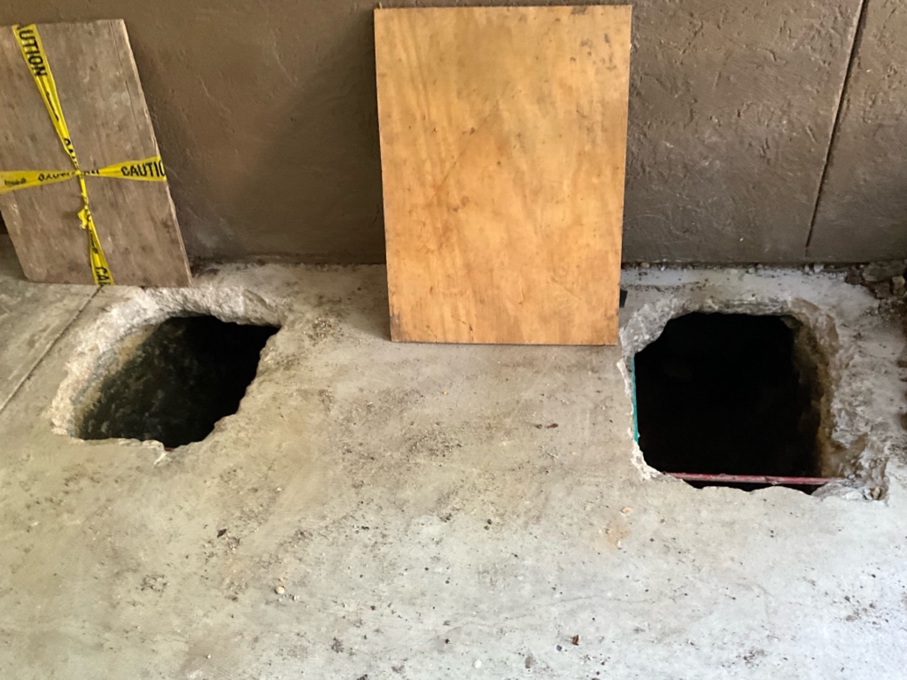 Open access holes covered with plywood and caution tape whenever crews stepped away