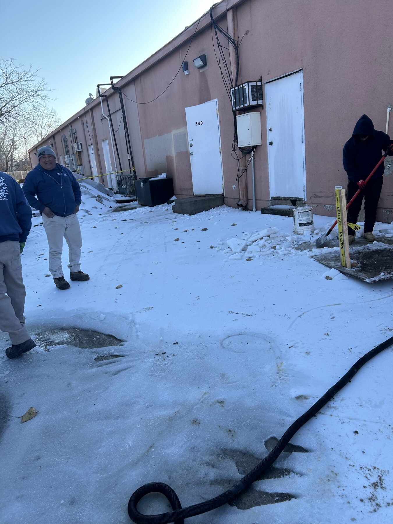 The mudjacking crew working through winter weather behind the center