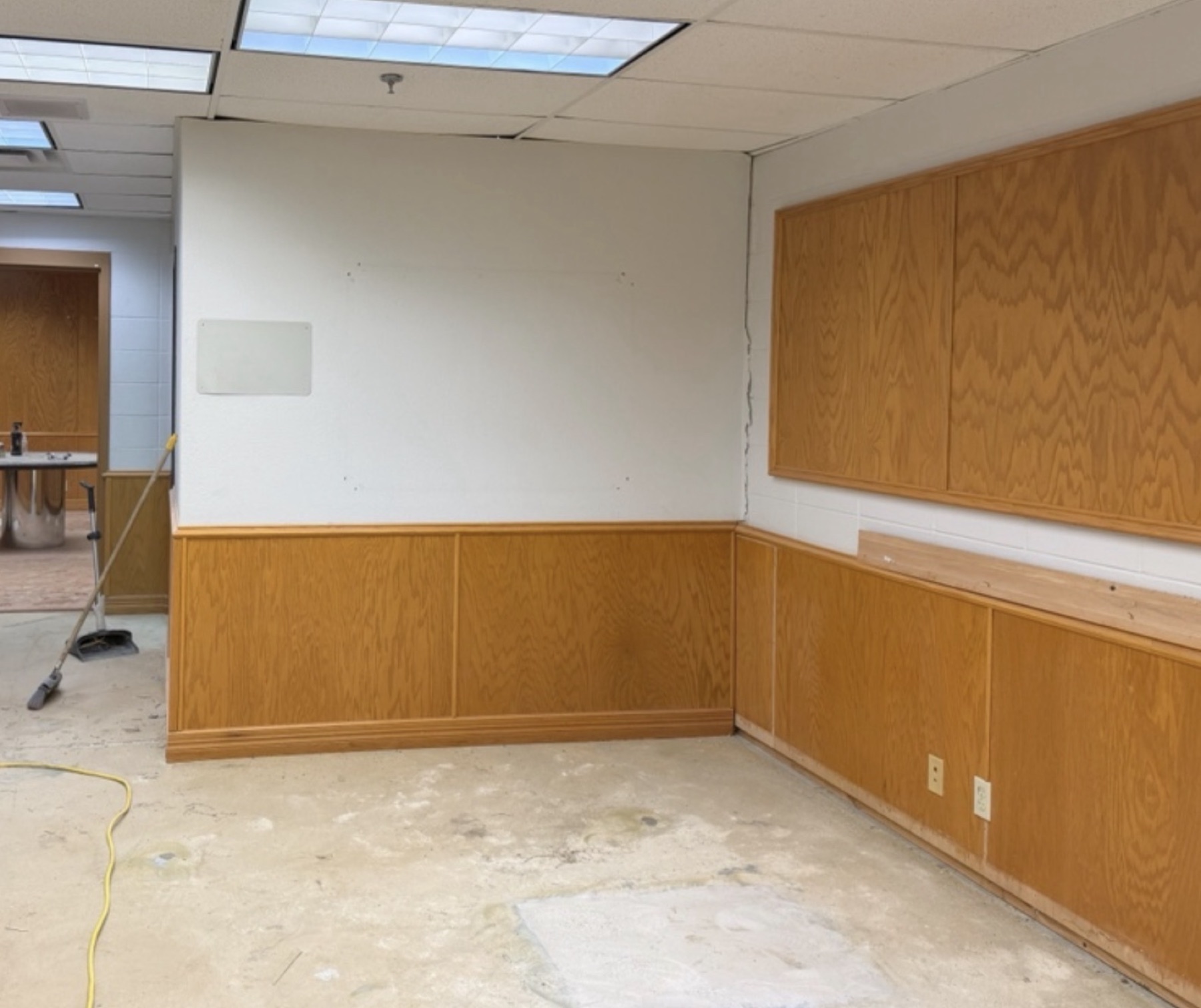 Furniture moved and floor coverings pulled back before the first cut