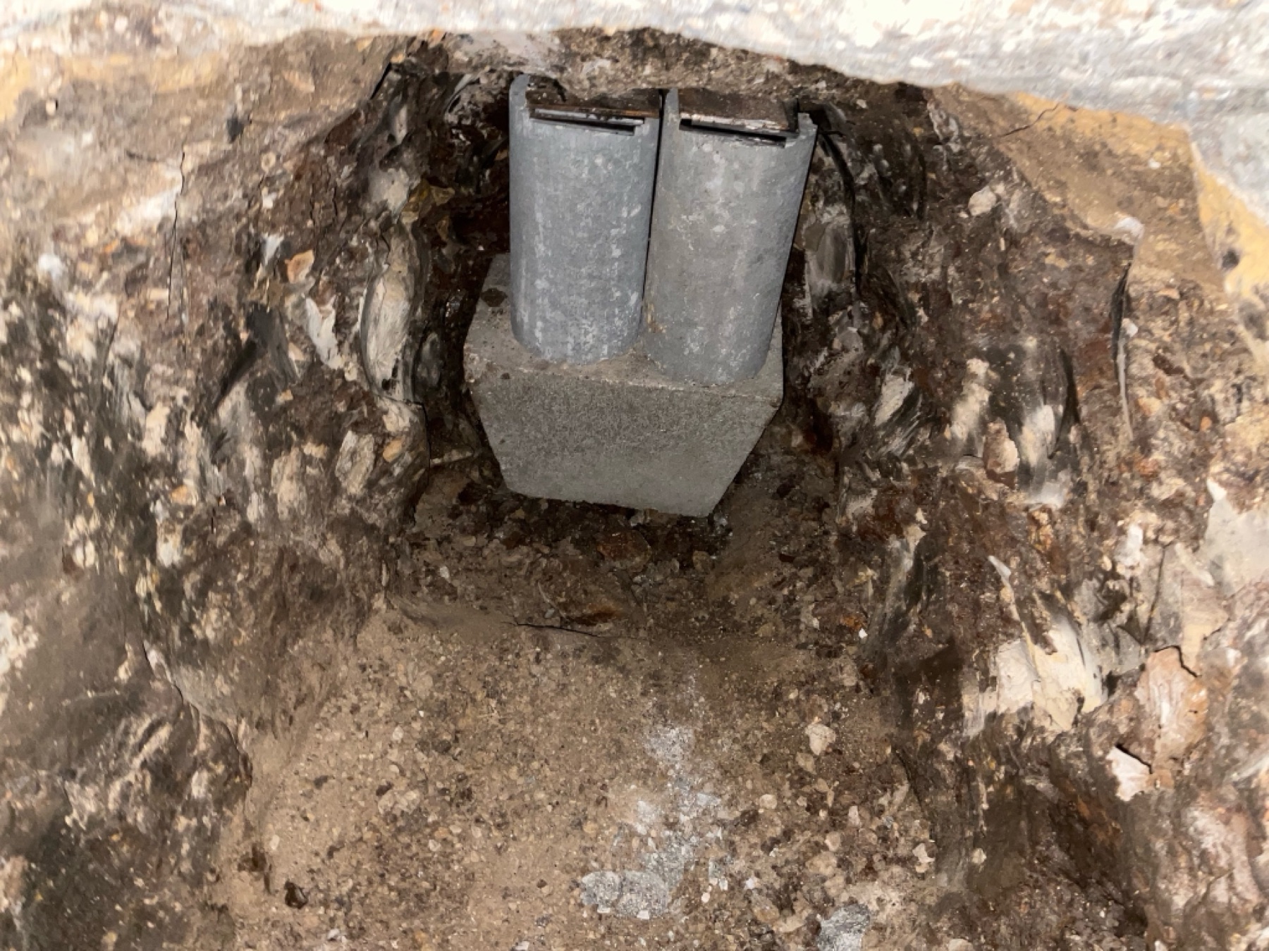 Paired steel pier piles and cap bracket — the hybrid system up close