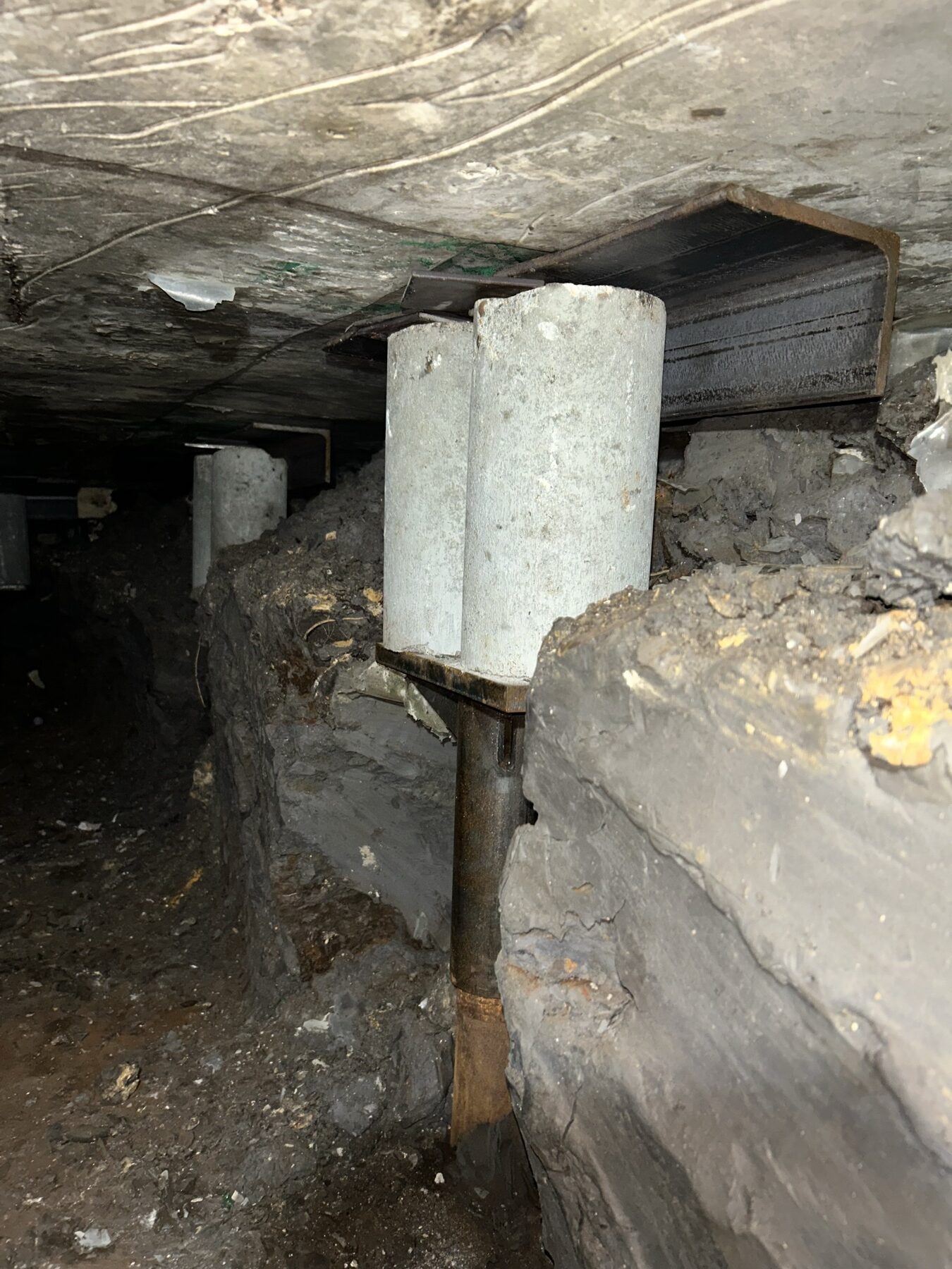 The tunnel network under the center — steel piers receding down the line